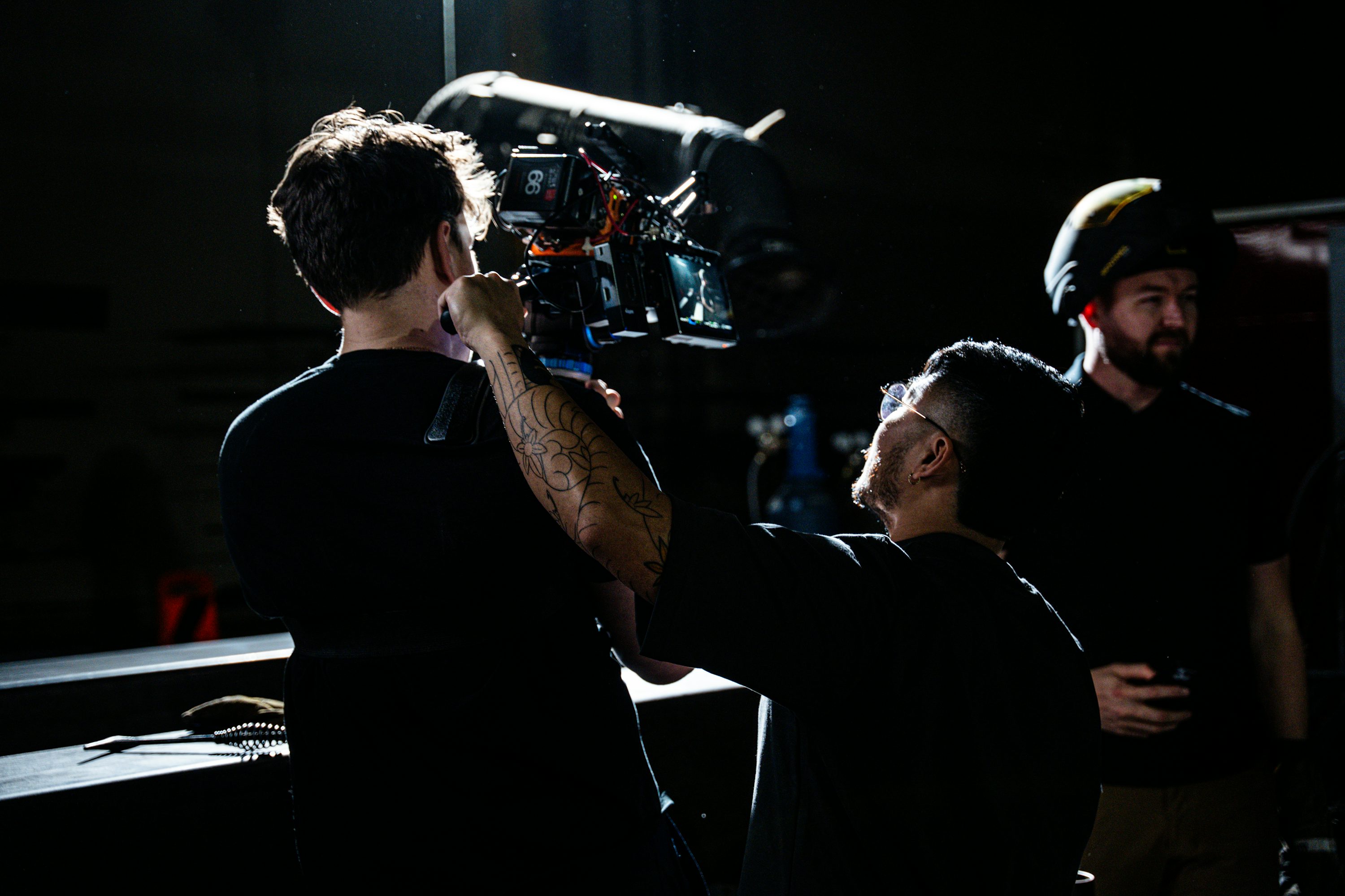 Event production team preparing camera equipment